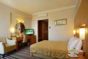 Postel nebo postele na pokoji v ubytování Grand Cettia Hotel + 37 fotografií