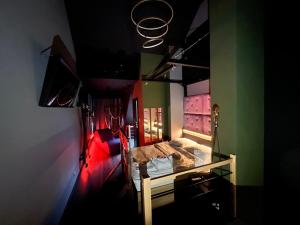 a bedroom with a bed in a room with green at BeDS&More in Wrocław