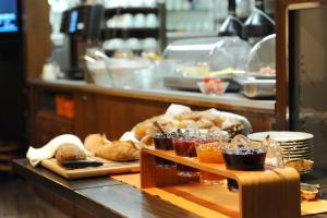 a bakery with bread and pastries on a counter at Hotel Dischma in Davos