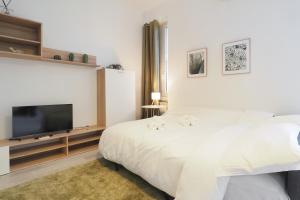 Un pat sau paturi într-o cameră la PrimoPiano - Volvinio