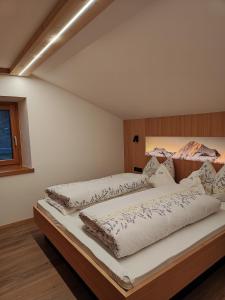 Postel nebo postele na pokoji v ubytování Residence Haus Peder