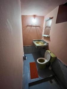 a bathroom with a toilet and a sink at Villa Djana Ouirgane in Ouirgane
