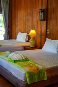 Postel nebo postele na pokoji v ubytování The Mangrove Hideaway Kohchang