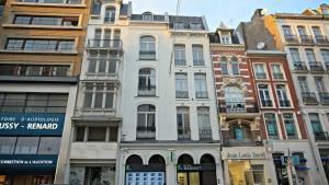 a row of tall buildings in a city at Little Suite - Nathan in Lille