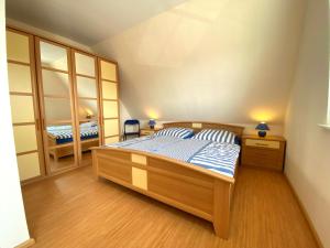 En eller flere senge i et værelse på Friesenhaus für 4