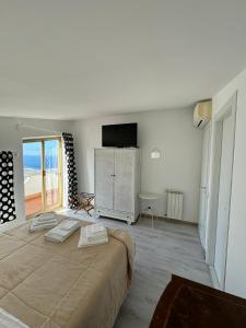 Ένα ή περισσότερα κρεβάτια σε δωμάτιο στο Sotto le Stelle