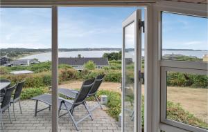 a view of the ocean from the patio of a house at Holiday Home Sardinvej With Fireplace And Shower in Ebeltoft