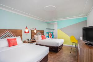 Postel nebo postele na pokoji v ubytování Beachside Hotel and Suites + 37 fotografií
