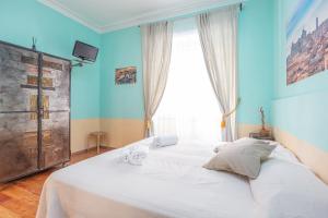 Postel nebo postele na pokoji v ubytování Vatican Rooms Haven