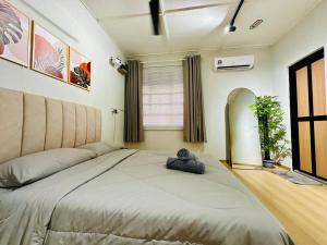 En eller flere senge i et værelse på My Muji Homestay I Massage Chair I Wifi 500 Mbps