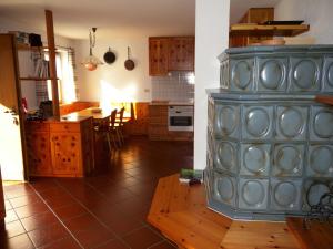 a kitchen with a large blue cabinet in a room at Appartamento Bellavista in Cavalese