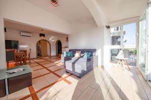 a living room with a couch and a table at Villa Haven by Algarve Vacation in Lagoa