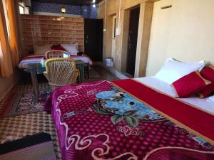 Łóżko lub łóżka w pokoju w obiekcie Hotel Desert