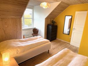 Postel nebo postele na pokoji v ubytování Silkeby Bed & Breakfast + 21 fotografií