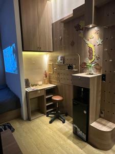 a small room with a desk and a chair at Tom's House 270 in Ho Chi Minh City