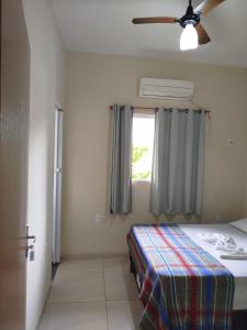 Ένα ή περισσότερα κρεβάτια σε δωμάτιο στο Hotel hawaii