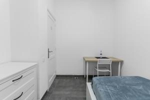 Postel nebo postele na pokoji v ubytování Urban Nest Suites