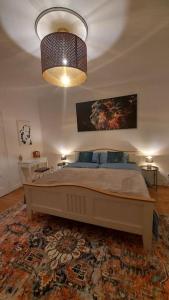 a bedroom with a bed and a large rug at Wohlfühl Landhaus in Habkirchen