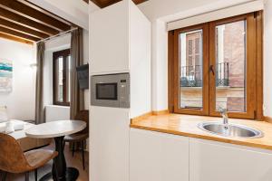 Η κουζίνα ή μικρή κουζίνα στο Stay U-nique Apartments Nosquera +87 φωτογραφίες