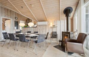 a dining room with a table and chairs and a fireplace at Gorgeous Home In Hemmet With Wifi in Hemmet