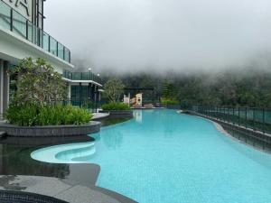 a swimming pool in the middle of a building at Vista Residences Genting Highlands Free WiFi & 1 Parking in Genting Highlands