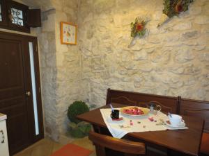 a table with a plate of food on it at La Casa di Giada in Modica