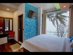TV a/nebo společenská místnost v ubytování Ripple Beach Inn