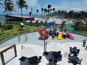 a playground with a water park with a water slide at Porto Alto Resort GAV em Muro Alto in Cupe