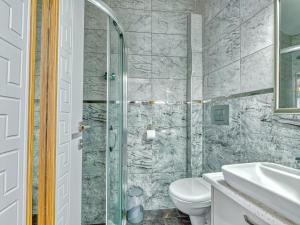 a bathroom with a toilet and a sink at GALATAGREENAPPLEHOTEL in Istanbul +48 photos