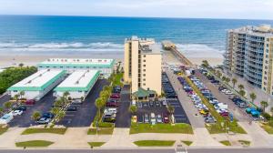 an aerial view of a parking lot next to the beach at "Summer Winds" at Sunglow Resorts with Spectacular Ocean Views in Daytona Beach Shores