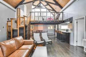 a living room with a couch and a table at 5 Mi to Dtwn Evergreen Mtn-View Escape in Evergreen