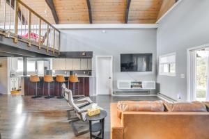 a living room with a couch and a table at 5 Mi to Dtwn Evergreen Mtn-View Escape in Evergreen