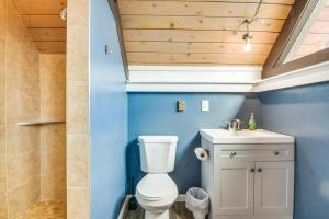 a bathroom with a toilet and a sink at 5 Mi to Dtwn Evergreen Mtn-View Escape in Evergreen