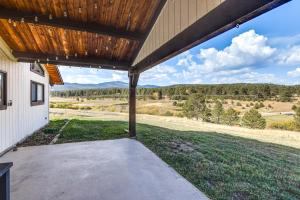 an open patio with a view of a field at 5 Mi to Dtwn Evergreen Mtn-View Escape in Evergreen