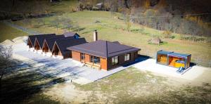 an overhead view of a house with a group of huts at Alpin Chalet in Rucăr