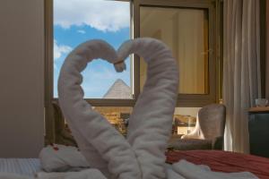 Postelja oz. postelje v sobi nastanitve Pyramids Palace INN