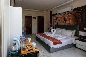 Postelja oz. postelje v sobi nastanitve Pyramids Palace INN