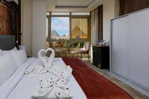 Postelja oz. postelje v sobi nastanitve Pyramids Palace INN