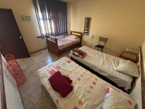 Postel nebo postele na pokoji v ubytování Hostal 509