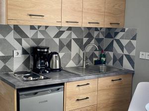 a kitchen with a sink and a counter top at The Central Retreat 4 in Mytilene