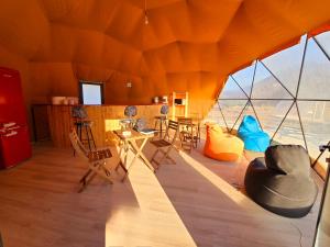 a room with chairs and tables in a tent at Ikigai Moonlight Garden in Iskele