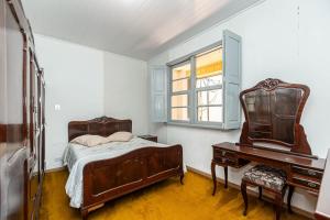 Postel nebo postele na pokoji v ubytování Memora Guesthouse Curitiba - Quartos em Casa próximo ao Parque Bacacheri