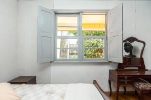 Postel nebo postele na pokoji v ubytování Memora Guesthouse Curitiba - Quartos em Casa próximo ao Parque Bacacheri