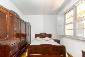 Postel nebo postele na pokoji v ubytování Memora Guesthouse Curitiba - Quartos em Casa próximo ao Parque Bacacheri