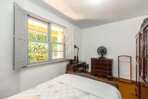 Postel nebo postele na pokoji v ubytování Memora Guesthouse Curitiba - Quartos em Casa próximo ao Parque Bacacheri