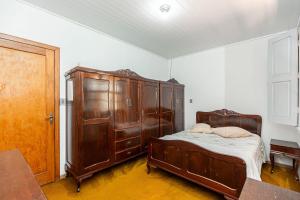 Postel nebo postele na pokoji v ubytování Memora Guesthouse Curitiba - Quartos em Casa próximo ao Parque Bacacheri