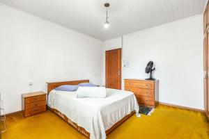Postel nebo postele na pokoji v ubytování Memora Guesthouse Curitiba - Quartos em Casa próximo ao Parque Bacacheri