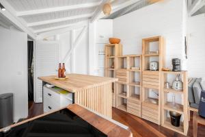 a kitchen with a wooden counter in a room at Le Spot - Unique house with view in Oyster Pond