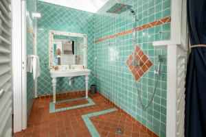 a bathroom with a sink and a mirror at Le Spot - Unique house with view in Oyster Pond