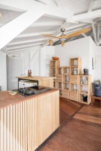 a kitchen with a wooden counter in a room at Le Spot - Unique house with view in Oyster Pond